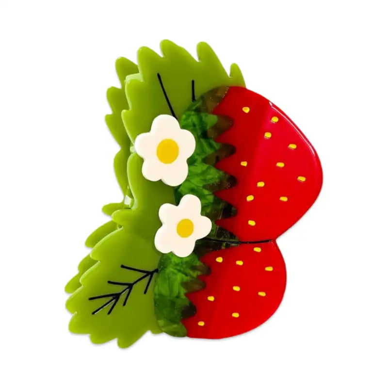 Butterfly-shaped hair clip with green wings and red body featuring white flowers on a white background
