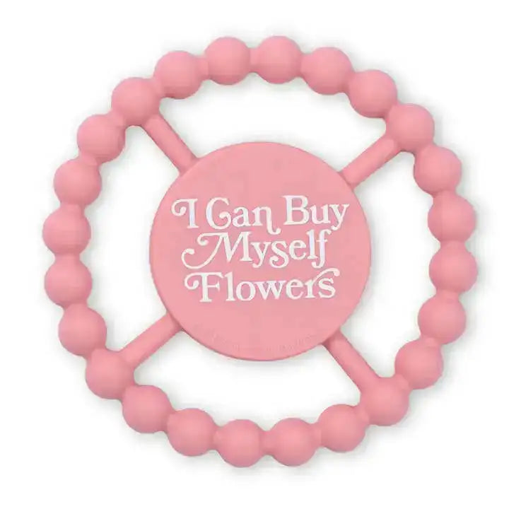 Pink beaded teething ring with 'I Can Buy Myself Flowers' text on a white background