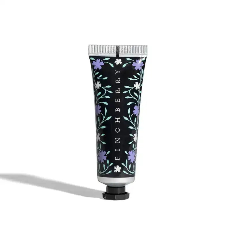 Hand cream tube with floral design and 'Finchberry' branding on a white background