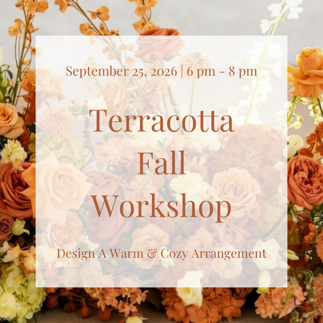 Terracotta-inspired fall floral arrangement featuring toffee roses, warm orange flowers, buttery yellow blooms, and seasonal autumn accents created during a floral workshop in Richardson, Texas.