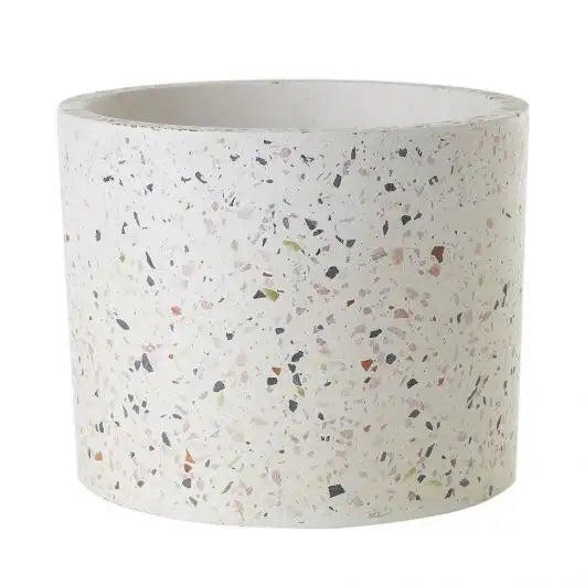 Cylindrical terrazzo planter on a white background