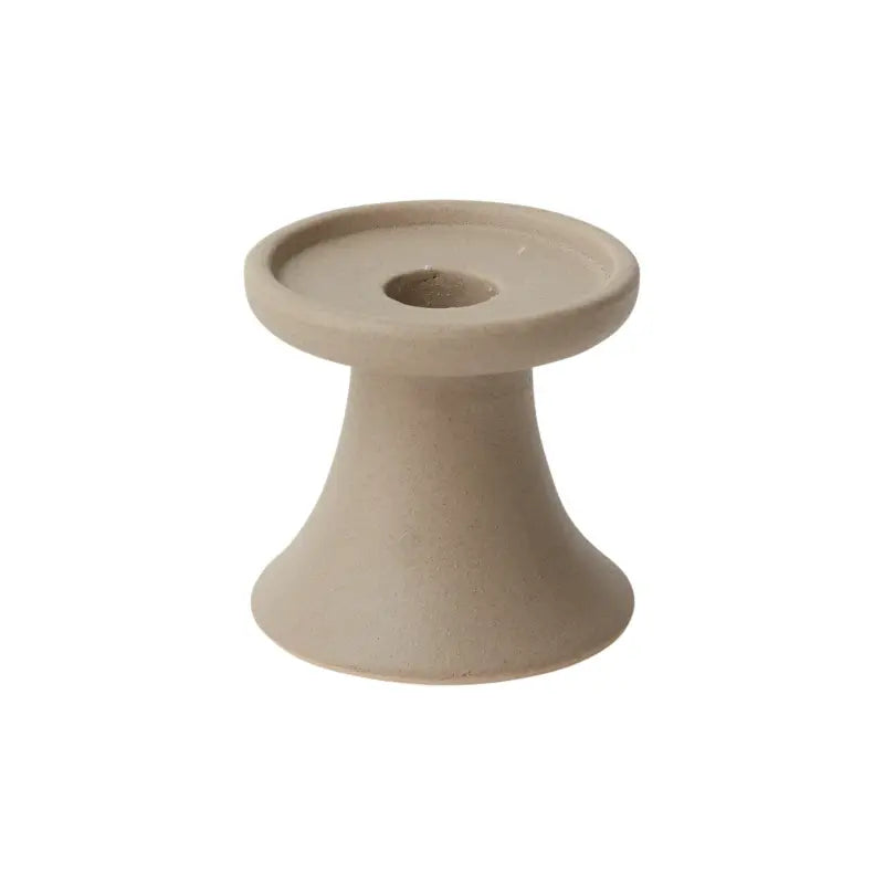 Beige ceramic candle holder on a white background