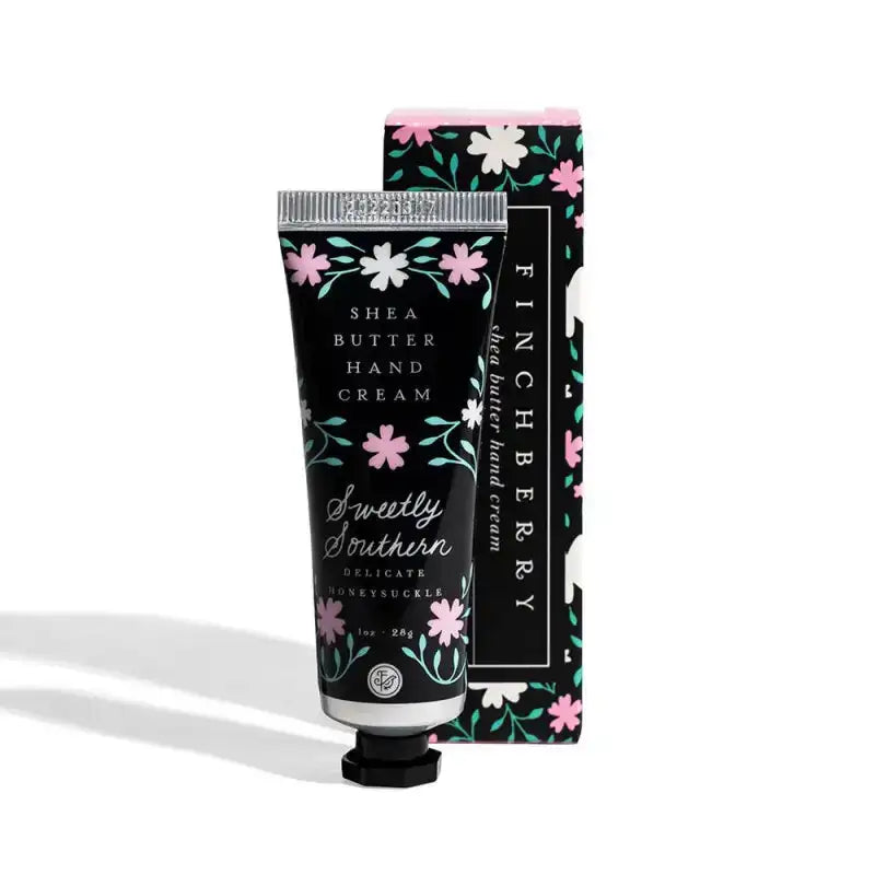 Shea butter hand cream with floral design packaging on a white background