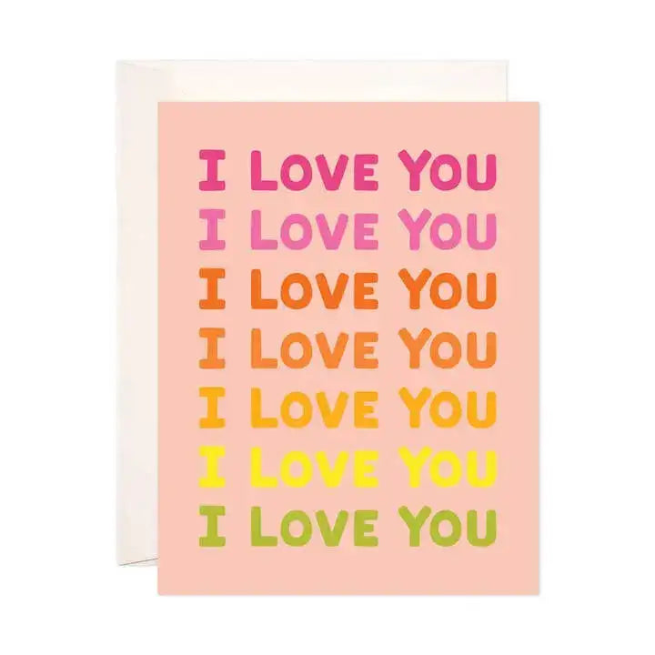 Card with 'I LOVE YOU' text in different colors on a pink background