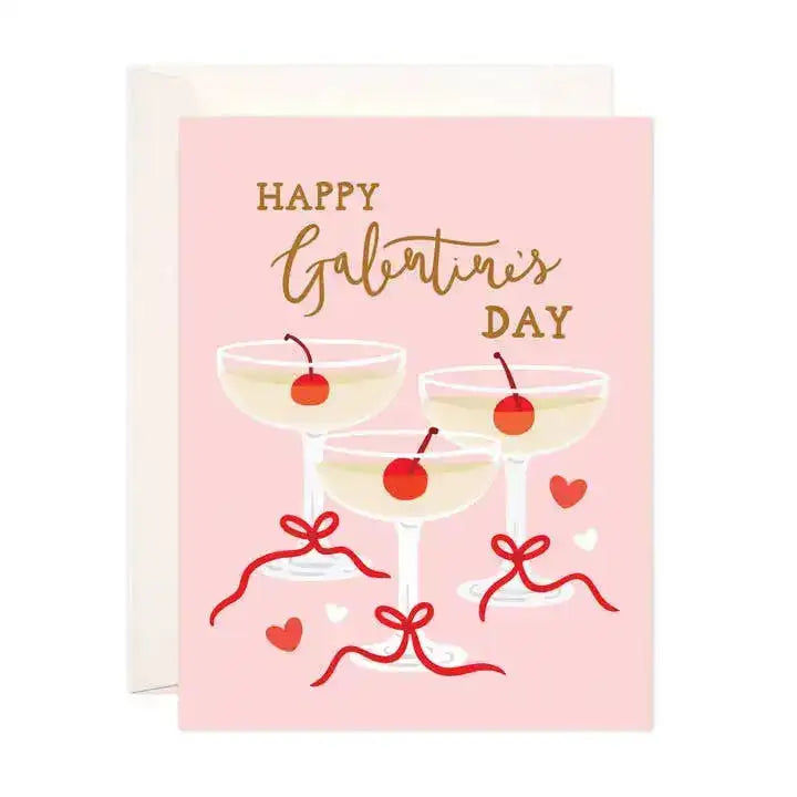 Greeting card with 'Happy Galentine's Day' text and illustrations of cocktails on a pink background.