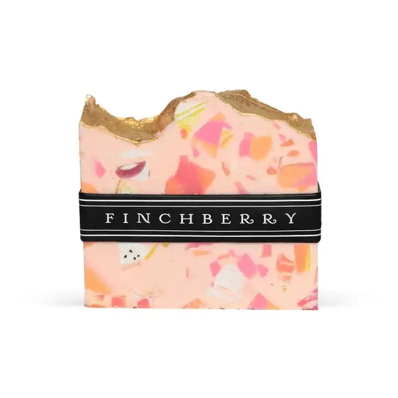 Bar of soap with a floral pattern and gold top, branded 'Finchberry', on a white background